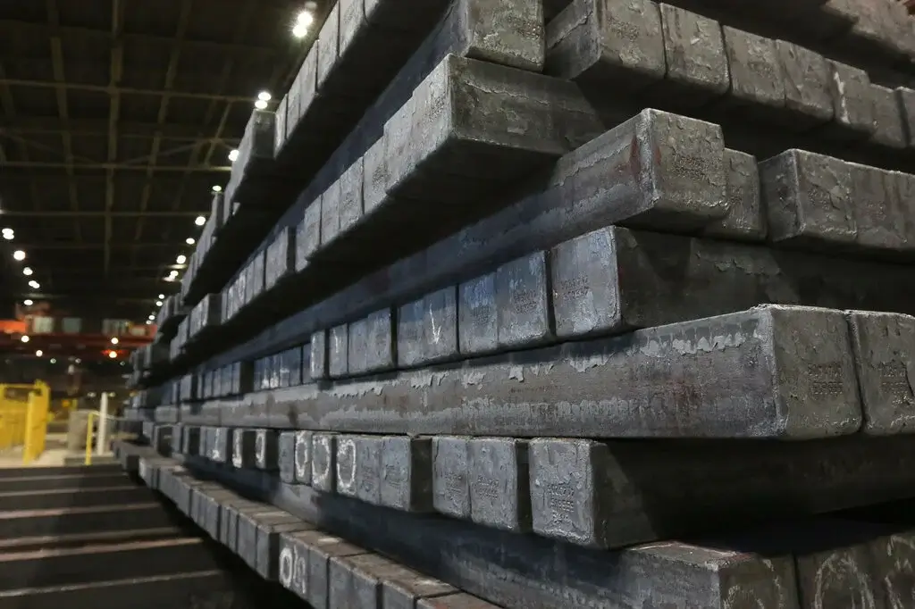 Raw billets of high-carbon steel.