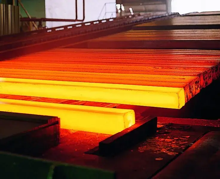 A steel billet being heated in a forge.