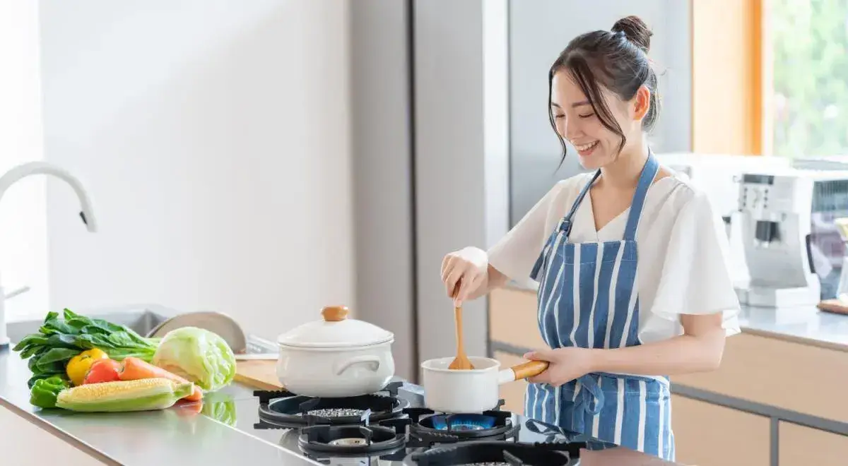 Minimalist kitchen scene with Kore Kitchen pots on the stove.